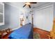 Bedroom with a ceiling fan, spacious closet, and access to a bathroom, offering comfort and convenience at 4603 S Bartlett St, Tampa, FL 33611