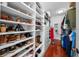 Custom walk-in closet with shelving, cabinets, and hanging space at 4603 S Bartlett St, Tampa, FL 33611