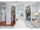 A luxurious main bedroom with access to two walk-in closets with custom shelving at 4603 S Bartlett St, Tampa, FL 33611