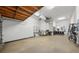 Bright, clean garage with painted floor and walls, storage solutions, and ample workspace for projects and parking at 4603 S Bartlett St, Tampa, FL 33611