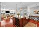 Open-concept kitchen with a large island, wine rack, farmhouse sink, and modern appliances at 4603 S Bartlett St, Tampa, FL 33611