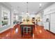Spacious kitchen boasts a large island, white cabinetry, and modern appliances for culinary enthusiasts at 4603 S Bartlett St, Tampa, FL 33611