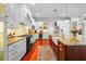 A spacious kitchen featuring white cabinets, stainless steel appliances, and granite countertops at 4603 S Bartlett St, Tampa, FL 33611