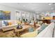 Spacious living room flows into kitchen, filled with natural light and stylish decor at 4603 S Bartlett St, Tampa, FL 33611