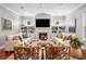 Cozy living room with a fireplace, built-in bookshelves, and large windows for natural light at 4603 S Bartlett St, Tampa, FL 33611