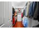 Organized walk-in closet featuring shelving, drawers and hanging storage for clothes and accessories at 4603 S Bartlett St, Tampa, FL 33611