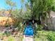 A colorful backyard featuring a small bridge and mature trees and landscaping at 5029 29Th S Ave, Gulfport, FL 33707