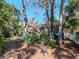 Cozy backyard featuring outdoor seating and mature trees at 5029 29Th S Ave, Gulfport, FL 33707