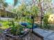 A backyard featuring a beautiful bridge over a serene pond and lots of mature landscaping at 5029 29Th S Ave, Gulfport, FL 33707