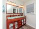 Bathroom featuring a double vanity with decorative lighting and spacious countertops at 5029 29Th S Ave, Gulfport, FL 33707