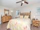 Bright bedroom featuring unique bamboo furniture set and ceiling fan at 5029 29Th S Ave, Gulfport, FL 33707