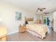 Bedroom features light yellow and green flower-themed bedding and an outdoor patio at 5029 29Th S Ave, Gulfport, FL 33707