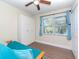 Bedroom with wood laminate flooring, natural light, and large wardrobe at 5029 29Th S Ave, Gulfport, FL 33707