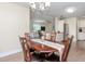 An inviting dining area next to the living room, with an elegant chandelier and wood table at 5029 29Th S Ave, Gulfport, FL 33707
