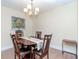 Elegant dining room with a wooden table, comfortable seating, and a chandelier at 5029 29Th S Ave, Gulfport, FL 33707