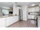 Well-lit kitchen with white cabinetry, stainless steel appliances, and granite countertops at 5029 29Th S Ave, Gulfport, FL 33707