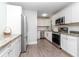 Updated kitchen featuring stainless appliances, granite countertops, and ample cabinet space at 5029 29Th S Ave, Gulfport, FL 33707