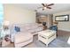 Inviting living space featuring a cozy couch and an open view into the dining area at 5029 29Th S Ave, Gulfport, FL 33707