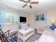 Comfortable living room with large windows, a sectional sofa, and a relaxing atmosphere at 5029 29Th S Ave, Gulfport, FL 33707
