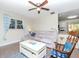 Bright living room features wood floors, comfortable seating, and open layout to kitchen at 5029 29Th S Ave, Gulfport, FL 33707
