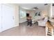 Spacious living room featuring wood laminate flooring, an open floor plan and great natural light at 5029 29Th S Ave, Gulfport, FL 33707
