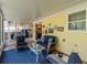 Bright sunroom with comfortable wicker furniture and access to backyard at 5029 29Th S Ave, Gulfport, FL 33707