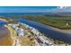 Scenic waterfront condos with beach access, boat docks, surrounded by lush greenery at 611 Destiny Dr # 304, Ruskin, FL 33570