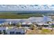Aerial view showcasing the condo complex with water views at 611 Destiny Dr # 304, Ruskin, FL 33570