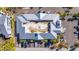 Birds eye view of condominium rooftop, parking area, and mature trees at 611 Destiny Dr # 304, Ruskin, FL 33570