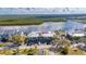 Aerial view of condo complex, lush greenery, and bay views at 611 Destiny Dr # 304, Ruskin, FL 33570