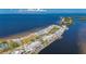 Gorgeous aerial view of waterfront condos featuring amazing ocean views, private docks, and community amenities at 611 Destiny Dr # 304, Ruskin, FL 33570