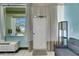 Inviting condo entryway featuring neutral paint, tiled floors, and access to amazing beachfront amenities and ocean views at 611 Destiny Dr # 304, Ruskin, FL 33570