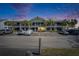 Two-story condominium building with palm trees and ample parking at 611 Destiny Dr # 304, Ruskin, FL 33570