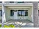 Condo exterior featuring a private patio with seating, ideal for relaxation and enjoying waterfront views at 611 Destiny Dr # 304, Ruskin, FL 33570