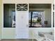 Close-up of a condo entrance with outdoor seating, creating a cozy and inviting atmosphere for residents and guests at 611 Destiny Dr # 304, Ruskin, FL 33570