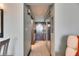Hallway with mirrored closet doors leading to the entrance, offering ample storage space at 611 Destiny Dr # 304, Ruskin, FL 33570