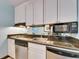 Well-equipped kitchen featuring stainless steel appliances, granite countertops and ample storage at 611 Destiny Dr # 304, Ruskin, FL 33570
