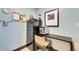Cozy kitchen corner featuring a black refrigerator and a small breakfast bar with comfortable seating at 611 Destiny Dr # 304, Ruskin, FL 33570