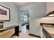 Efficient kitchenette with modern appliances, convenient breakfast bar, and seamless access to the cozy and stylish living area at 611 Destiny Dr # 304, Ruskin, FL 33570