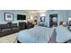 Comfortable living space featuring modern decor, tiled floors, and beach-themed accents, complete with a stylish sofa at 611 Destiny Dr # 304, Ruskin, FL 33570