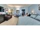 Contemporary living space featuring modern decor, tiled floors, and beach-themed accents, complete with a comfortable sofa at 611 Destiny Dr # 304, Ruskin, FL 33570
