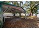 Spacious carport in backyard with room for parking and covered storage at 6907 N 12Th St, Tampa, FL 33604