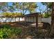 Spacious metal carport in the backyard, offering covered parking or storage solutions at 6907 N 12Th St, Tampa, FL 33604