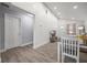 Open-concept dining area with wood flooring, blending seamlessly into the living space at 6907 N 12Th St, Tampa, FL 33604
