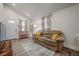 Comfortable living room featuring wood flooring, bright lighting, and open access to other rooms at 6907 N 12Th St, Tampa, FL 33604