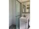 Bathroom featuring a glass enclosed shower with white subway tile and a modern vanity at 7111 N 53Rd St, Tampa, FL 33617