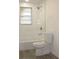 Bathroom featuring a tub/shower combination with white tile at 7111 N 53Rd St, Tampa, FL 33617