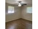 Bright bedroom with wood-look floors and a ceiling fan at 7111 N 53Rd St, Tampa, FL 33617