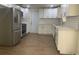 Modern kitchen featuring white cabinets, stainless steel appliances, and wood-look floors at 7111 N 53Rd St, Tampa, FL 33617