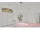 Light-filled living room with double doors and a large arched window at 726 Hidden Lake Dr, Tarpon Springs, FL 34689